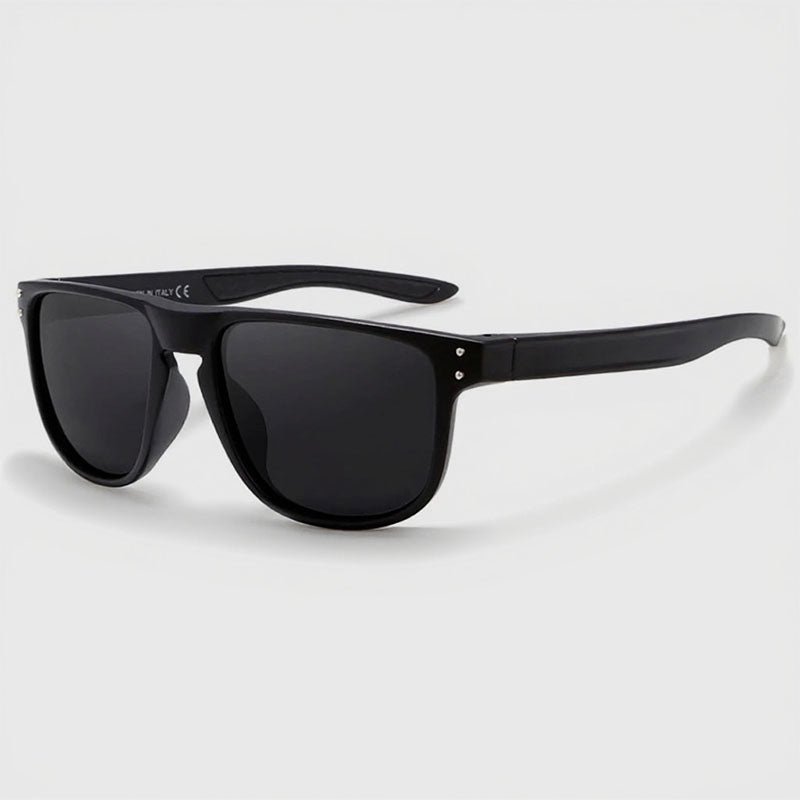 Black sunglasses with dark lenses on a light gray background
