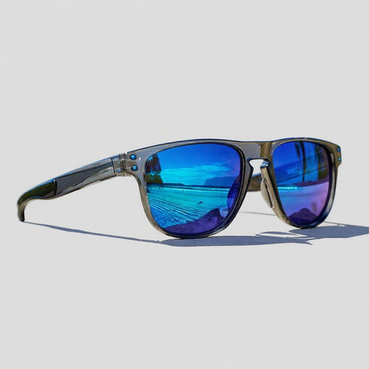 Sunglasses with blue reflective lenses on a light gray background