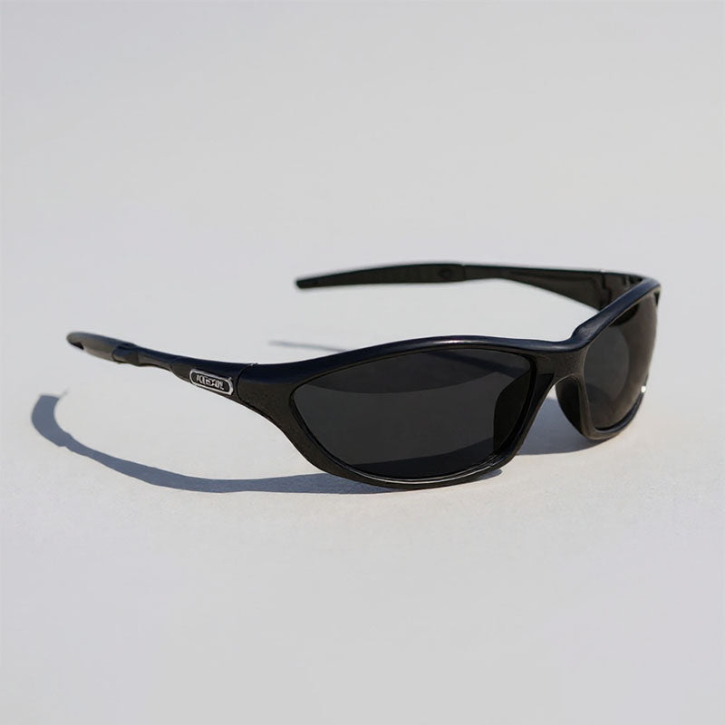 Black sunglasses on a light gray background