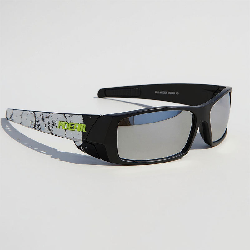 Sunglasses with a black frame and gray lenses on a light gray background